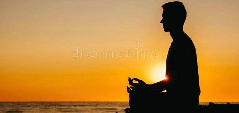 Meditation at sunset in Algarve